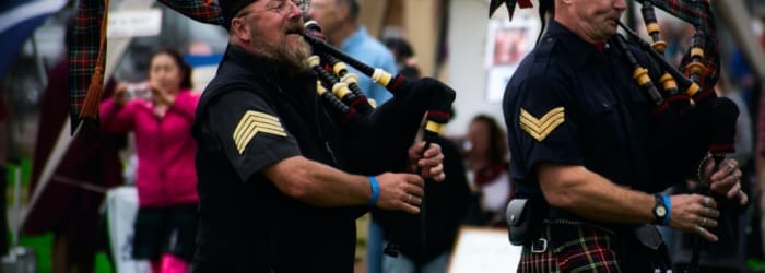 Men playing bagpipes at the highland games